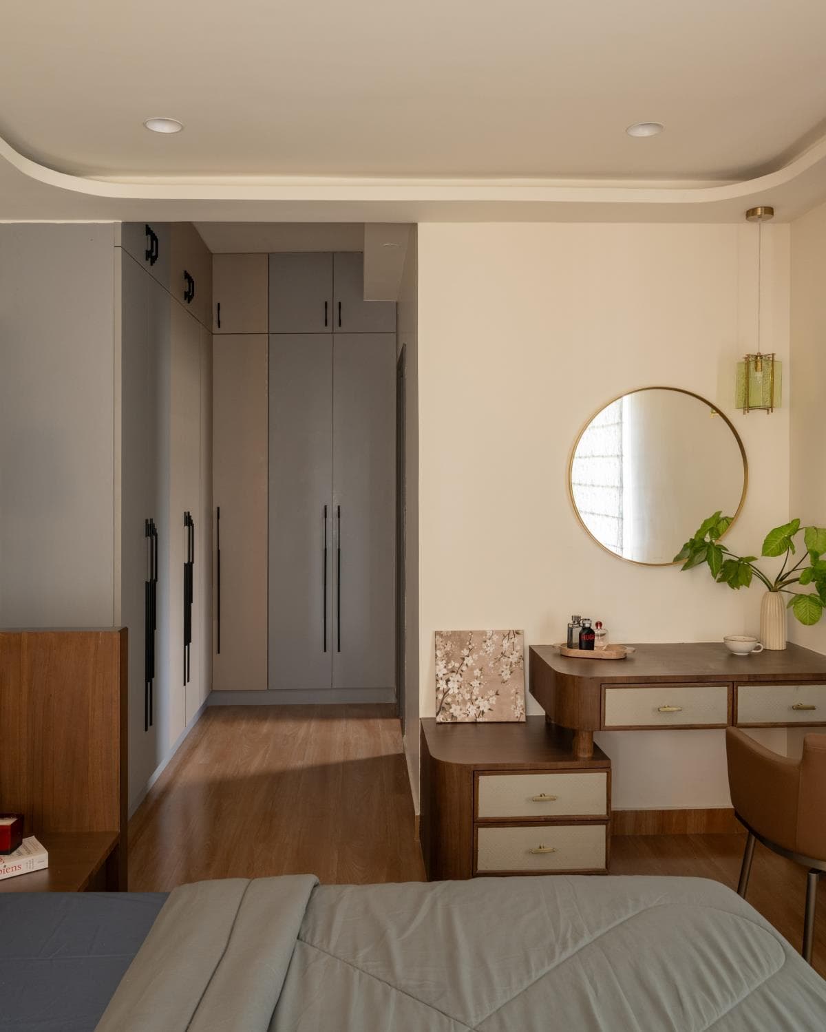 Floor-to-ceiling wardrobe in the master bedroom with matte-finish shutters